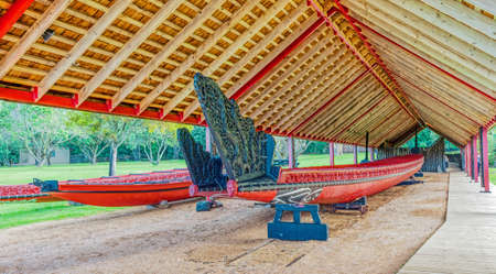 WAITANGI, NEW ZEALAND - JUNE 1, 2010: Ceremonial Maori war canoes (waka taua) in the Waka house at Waitangi Treaty Grounds, New Zealand.のeditorial素材