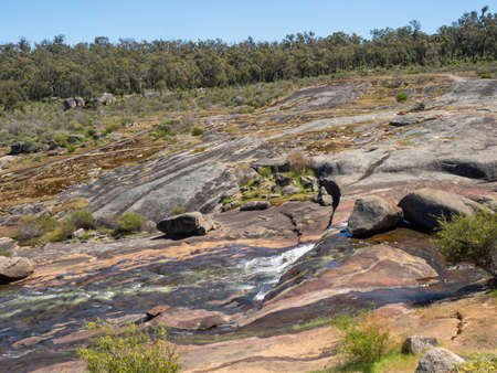Hovea Falls on the Jane Brook in John Forrest National Park, near Perth in Western Australia, cascades down a large granite sheet in winter and spring.の写真素材