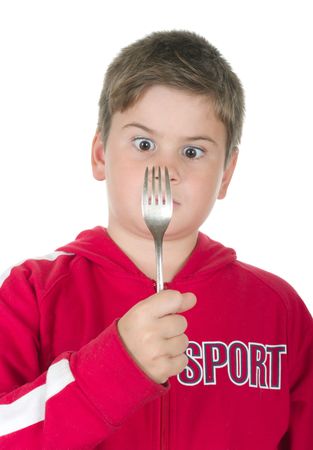 Boy looks at a plug on a white backgroundの写真素材
