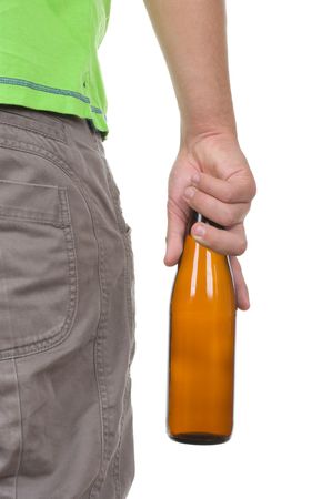 Teenager holds a bottle on a white backgroundの写真素材