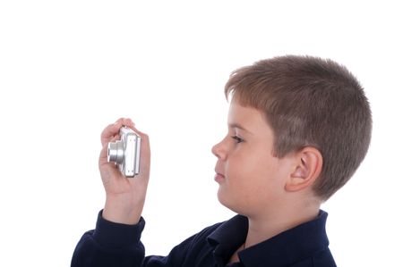 The boy photographs the camera on a white backgroundの写真素材