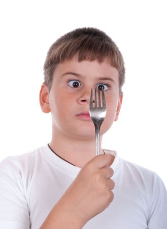 The boy looks at a plug on a white backgroundの写真素材