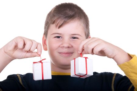 Boy holds gifts on  white backgroundの写真素材