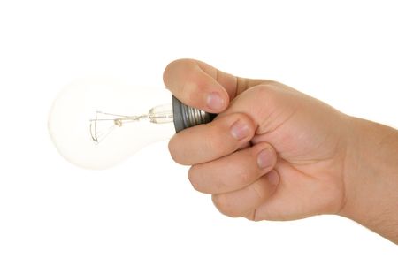 Hand cocks snook incandescent lamp on white backgroundの写真素材