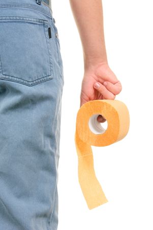 Roll of yellow toilet paper in hand on white backgroundの写真素材