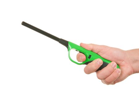 Hand holds gas lighter on white backgroundの写真素材