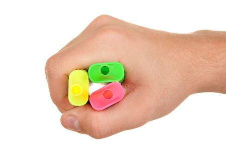 Hand holds colour markers on white backgroundの写真素材