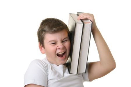 Happy boy holds some books and smiles isolated in whiteの写真素材