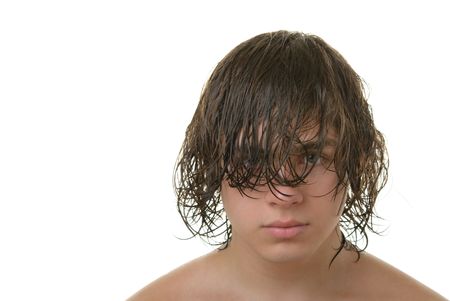 Teenager with long wet hair it isolated in whiteの写真素材