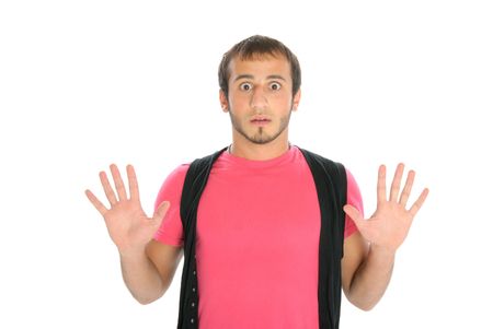 Surprised young man isolated in whiteの写真素材