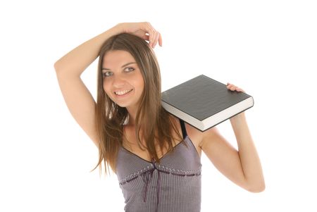 Young happy woman with book isolated in whiteの写真素材