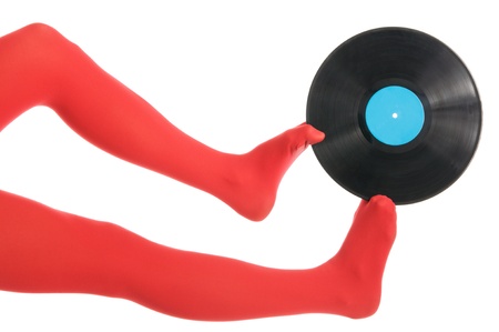 Female feet with vinyl recordの写真素材