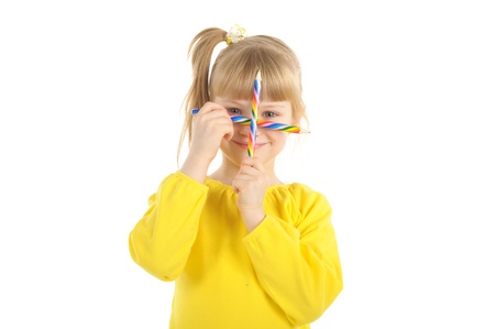 Little girl with colour pencilsの写真素材