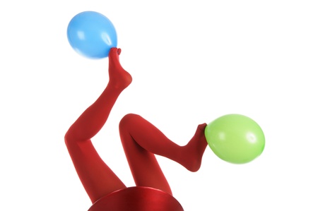 Female feet in red stockings with balloonsの写真素材