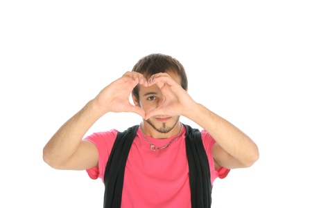 Young man shows heart symbolの写真素材