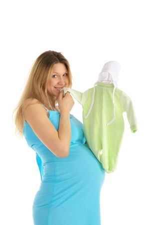 pregnant woman buying baby clothesの写真素材