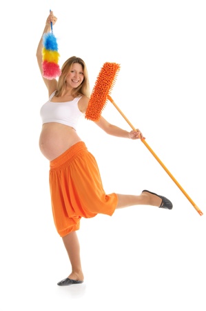 happy pregnant woman with a mop and brushの写真素材