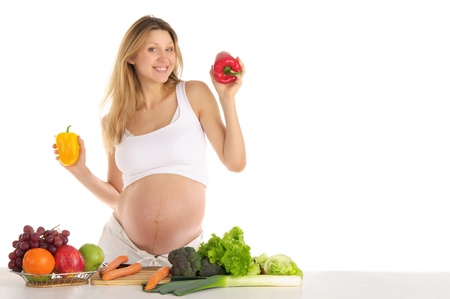 pregnant woman with fruits and vegetablesの写真素材