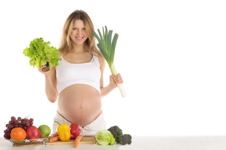 pregnant woman with fruits and vegetablesの写真素材