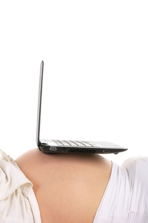 laptop on  stomach pregnant womanの写真素材