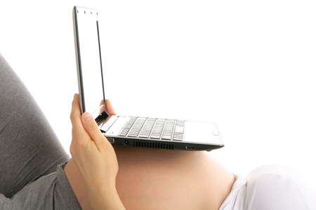 laptop on  stomach pregnant womanの写真素材