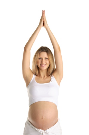 Pregnant woman practicing yogaの写真素材