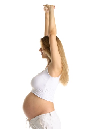 Pregnant woman practicing yogaの写真素材