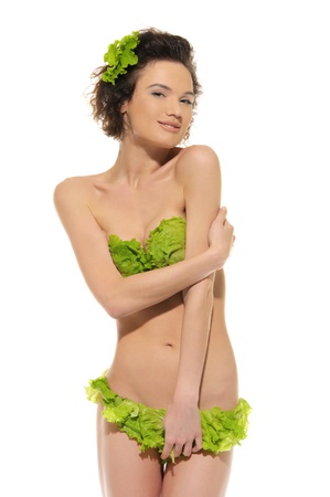 sexy woman with cabbage and green lettuceの写真素材