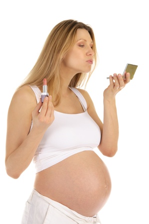 pregnant woman and mirror with lipstickの写真素材