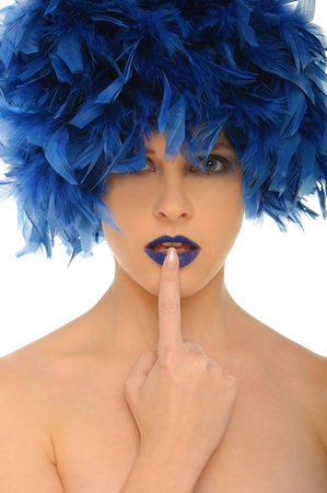 woman with blue feathers lips and open eyesの写真素材