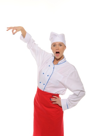 surprised female chef picks upの写真素材