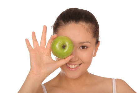 smiling asian woman with green appleの写真素材