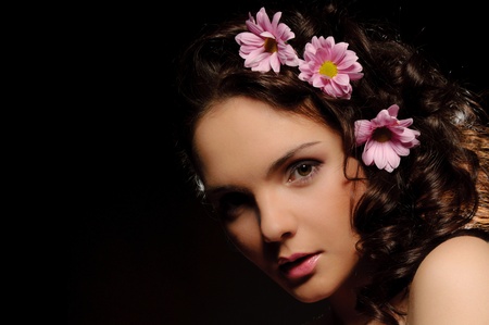 Beautiful woman with flowers in their hairの写真素材
