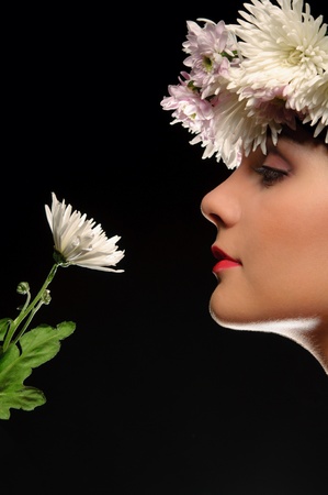 Beautiful woman with flowers in their hairの写真素材