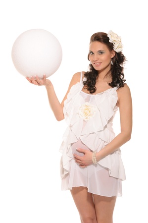 pregnant woman holding white ballの写真素材