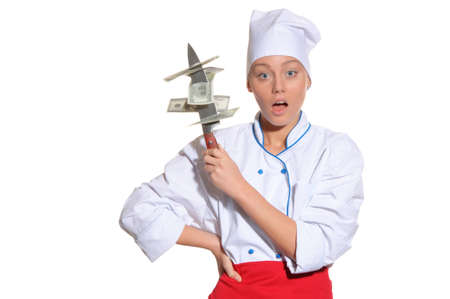 surprised woman- chef with knife and money isolated on whiteの写真素材