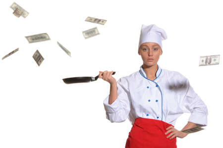 woman-cook frying pan catches money isolated on whiteの写真素材