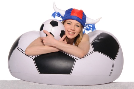 Happy football cheerleader with ballの写真素材