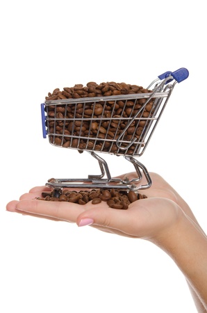 coffee beans in shopping trolley on the palmの写真素材