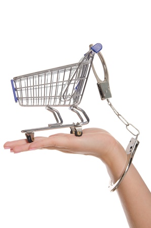 Shopping cart handcuffed to the armの写真素材