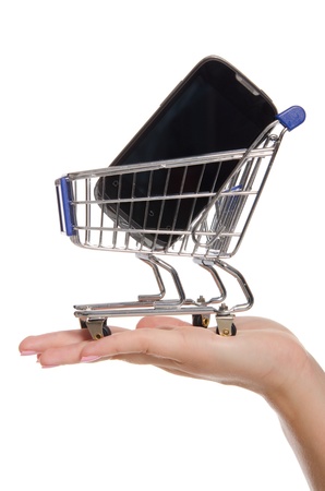 smartphone in shopping trolley on the palmの写真素材