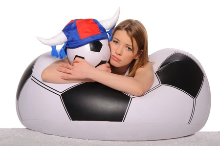 Distressed football cheerleader with  ballの写真素材