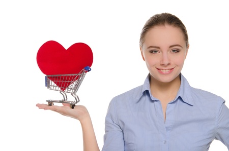 woman with heart symbol in shopping cartの写真素材