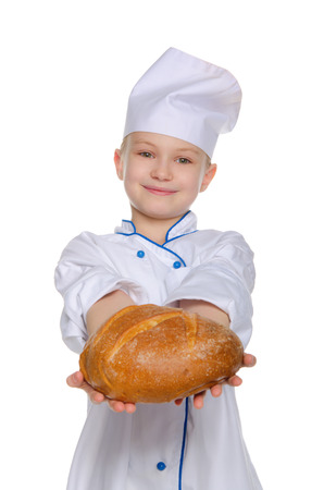 Smiling chef with a loaf of bread Isolated on whiteの写真素材