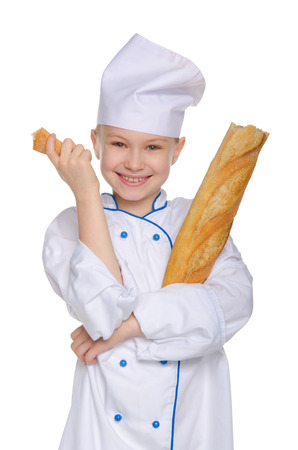 Baker with a piece of bread Isolated on whiteの写真素材