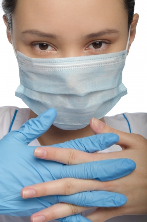 Doctor gloved hands folded isolated on whiteの写真素材