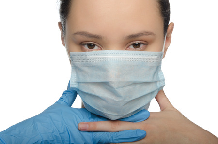 Doctor gloved fingers crossed isolated on whiteの写真素材