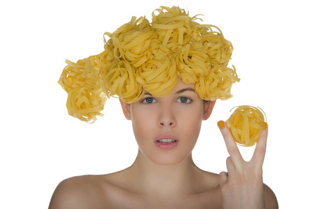 Nude young woman with creative hairstyle noodleの写真素材