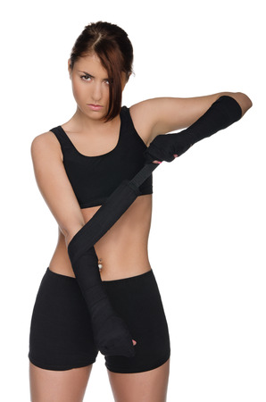 Brave yuong woman prepares for battle sportの写真素材