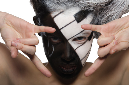 Horizontal portrait with musical makeup and rock gesture isolated on white
